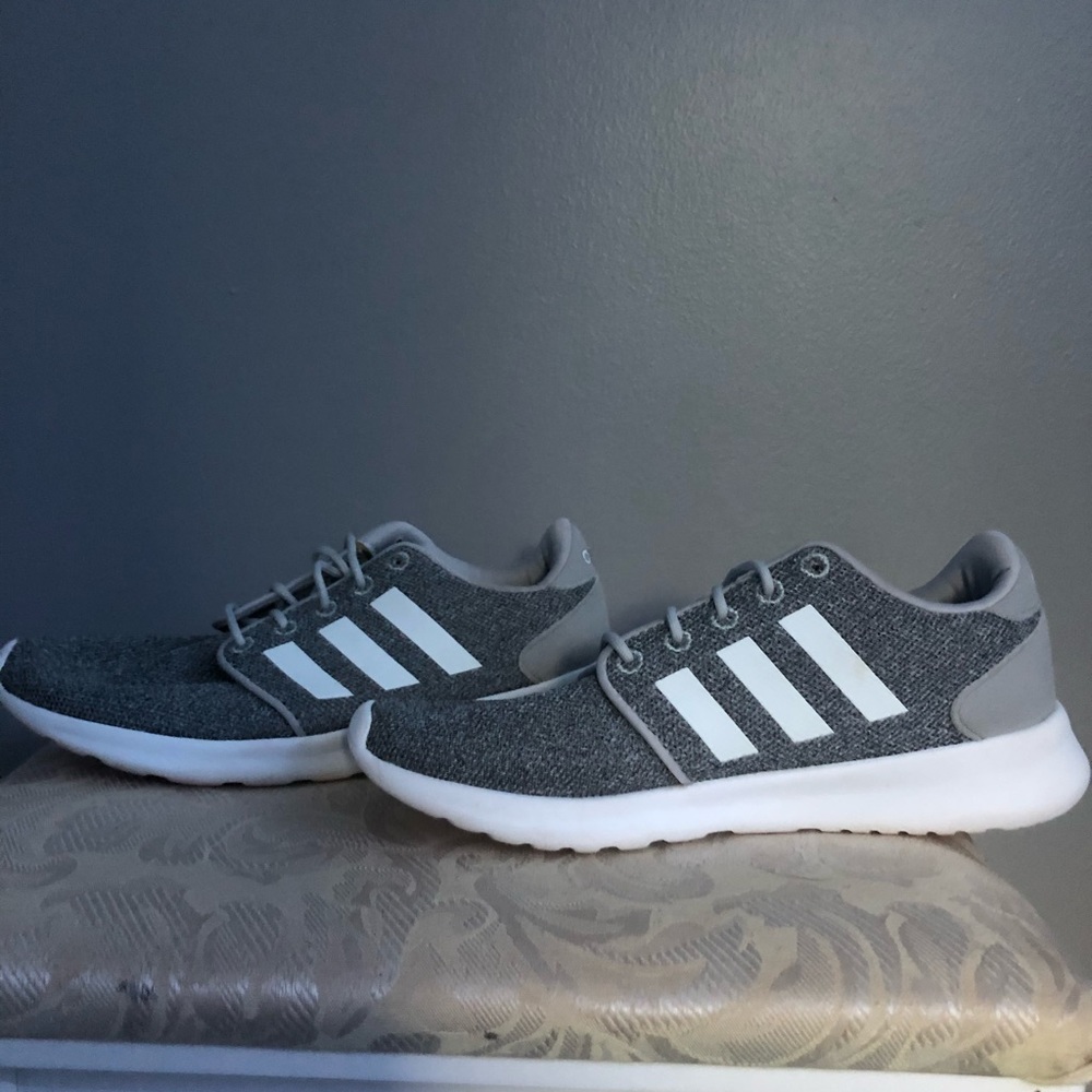 Grey Adidas cloud foam shoes.